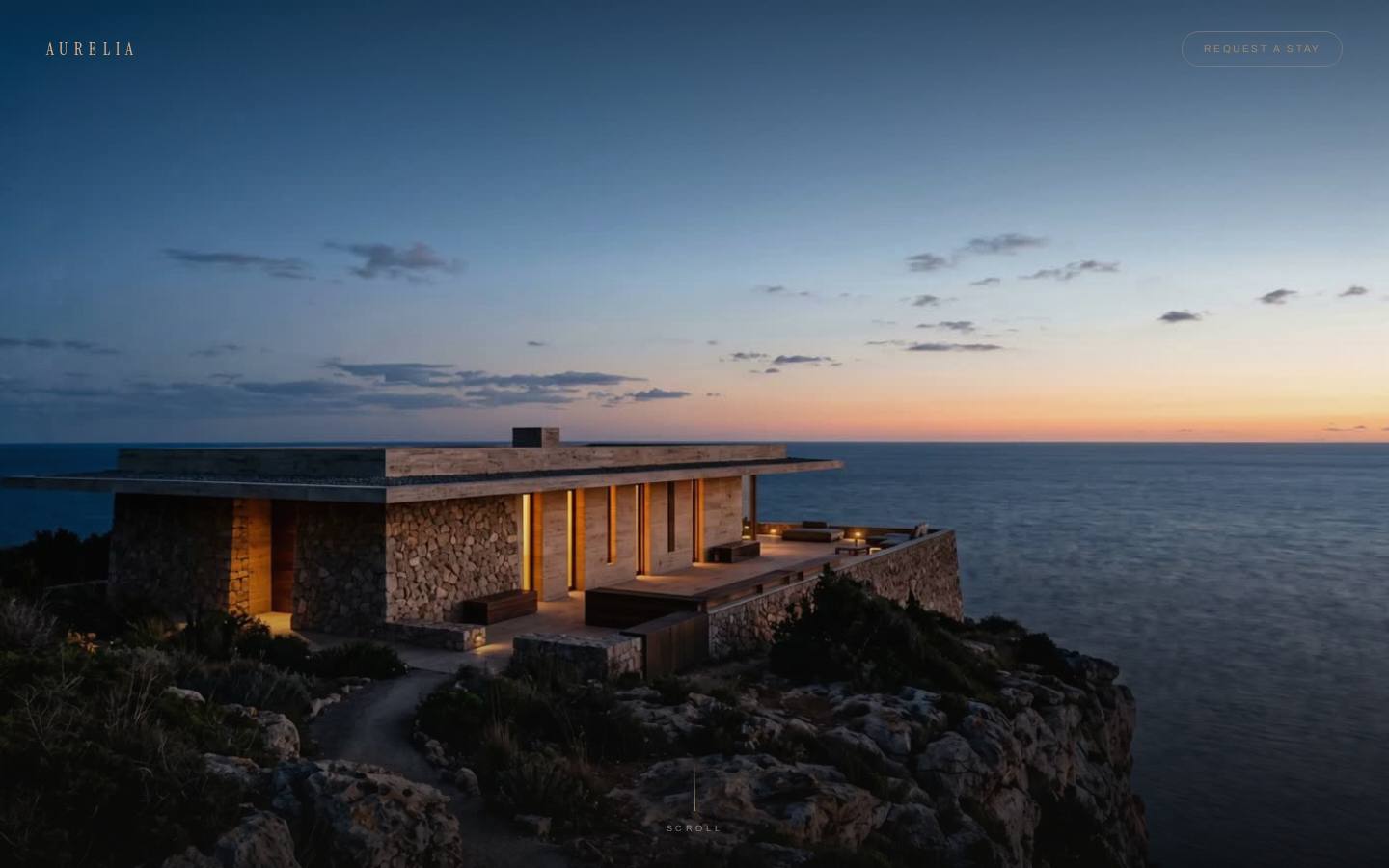 Aurelia — a stone coastal house at dusk above the sea